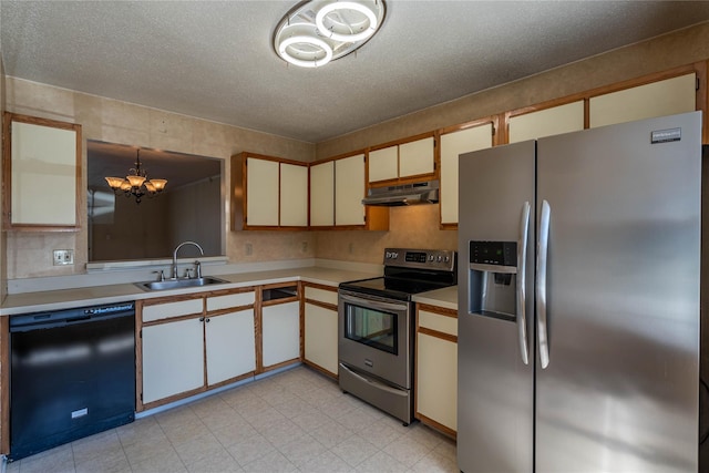 24 Timberline Trl, Pawling, NY 12564 - kitchen with a sink, appliances with stainless steel finishes, light countertops, under cabinet range hood, and an inviting chandelier