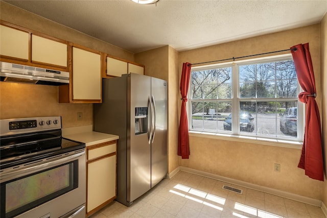 24 Timberline Trl, Pawling, NY 12564 - kitchen featuring under cabinet range hood, visible vents, baseboards, light countertops, and appliances with stainless steel finishes