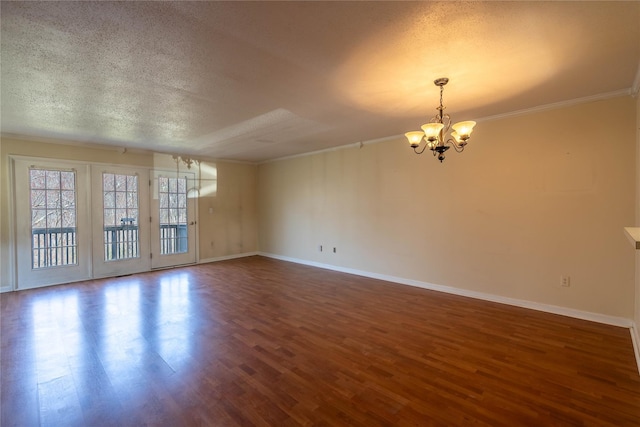24 Timberline Trl, Pawling, NY 12564 - spare room featuring a notable chandelier, baseboards, ornamental molding, a textured ceiling, and wood finished floors
