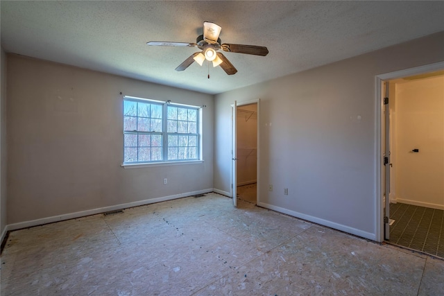 24 Timberline Trl, Pawling, NY 12564 - unfurnished bedroom featuring baseboards, visible vents, a ceiling fan, and a textured ceiling