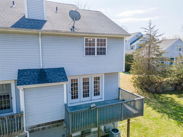 24 Timberline Trl, Pawling, NY 12564 - back of house with a chimney, a deck, a shingled roof, a yard, and central AC