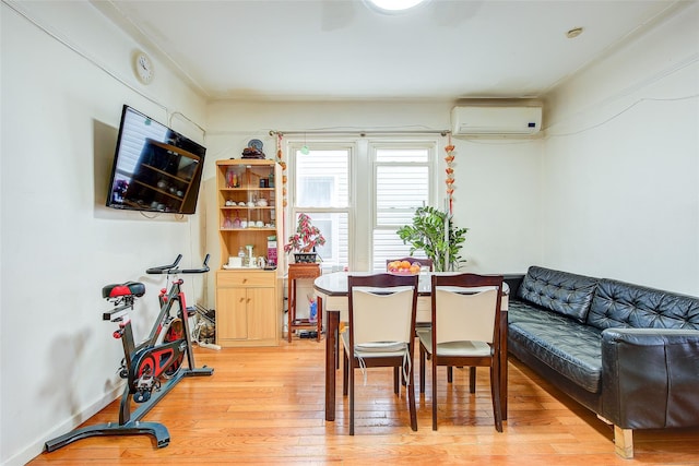 121-41 6th Ave, College Point, NY 11356 - dining area with a wall mounted air conditioner and light wood finished floors