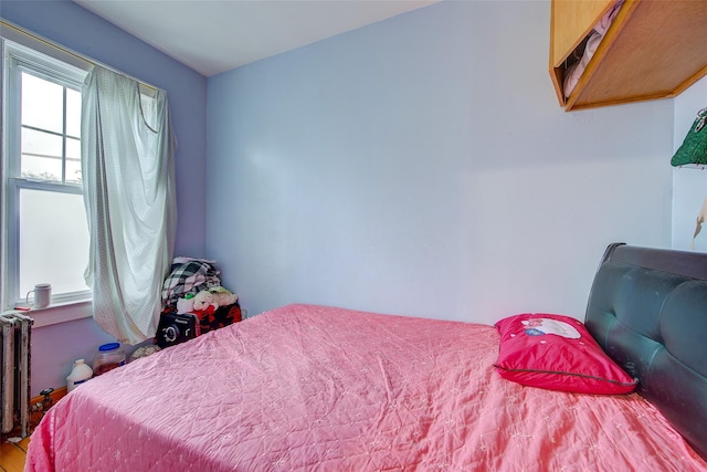 121-41 6th Ave, College Point, NY 11356 - bedroom with radiator and wood finished floors