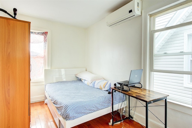 121-41 6th Ave, College Point, NY 11356 - bedroom featuring hardwood / wood-style floors and a wall mounted AC