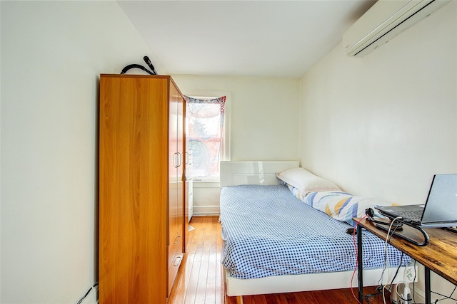 121-41 6th Ave, College Point, NY 11356 - bedroom featuring a wall mounted air conditioner and hardwood / wood-style flooring