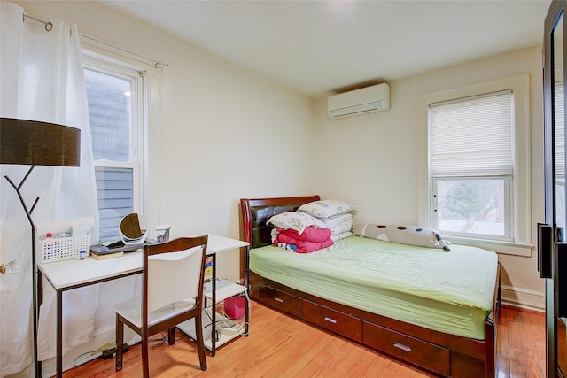 121-41 6th Ave, College Point, NY 11356 - bedroom with wood finished floors and a wall mounted air conditioner