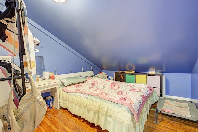 121-41 6th Ave, College Point, NY 11356 - bedroom featuring lofted ceiling and wood finished floors