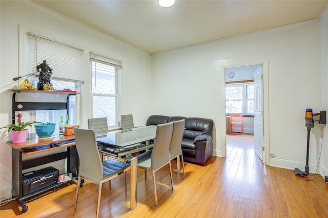 121-41 6th Ave, College Point, NY 11356 - dining space featuring plenty of natural light, light wood finished floors, and baseboards