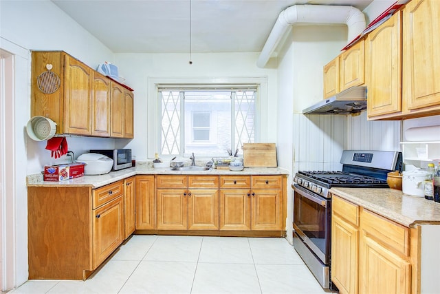 121-41 6th Ave, College Point, NY 11356 - kitchen featuring a sink, light tile patterned flooring, light countertops, under cabinet range hood, and stainless steel gas stove