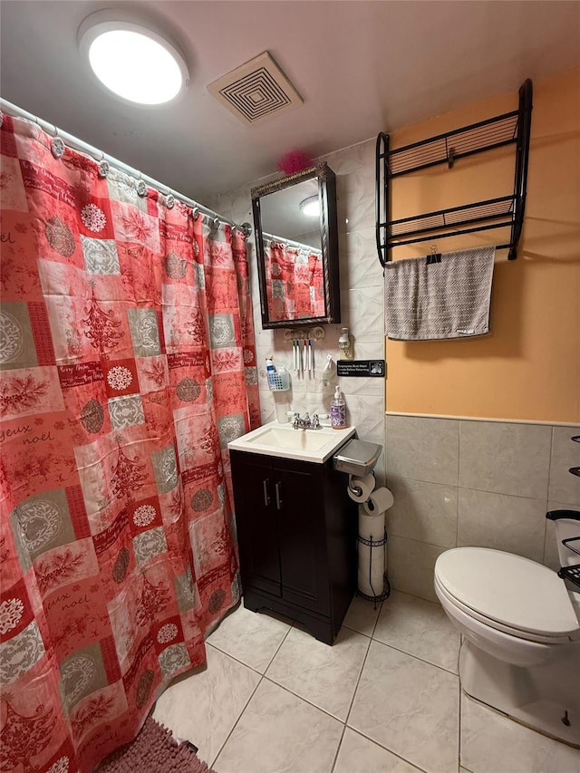 121-41 6th Ave, College Point, NY 11356 - full bathroom with toilet, tile walls, visible vents, tile patterned flooring, and vanity