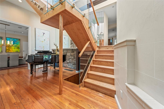 stairs with hardwood / wood-style flooring