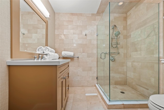 full bath featuring a shower stall, toilet, and vanity