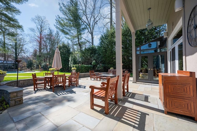 view of patio with outdoor dining area and french doors