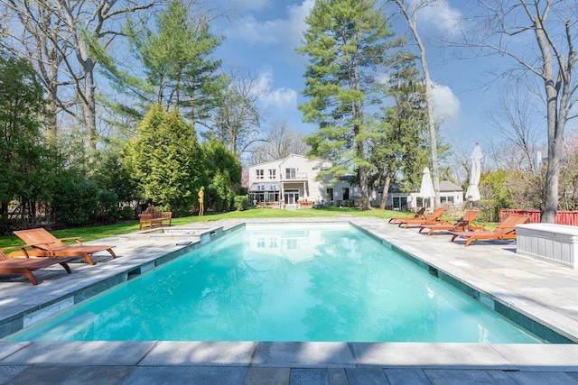 pool with a patio area