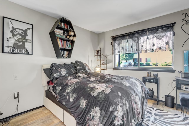 bedroom featuring wood finished floors