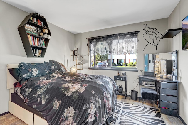 bedroom with wood finished floors