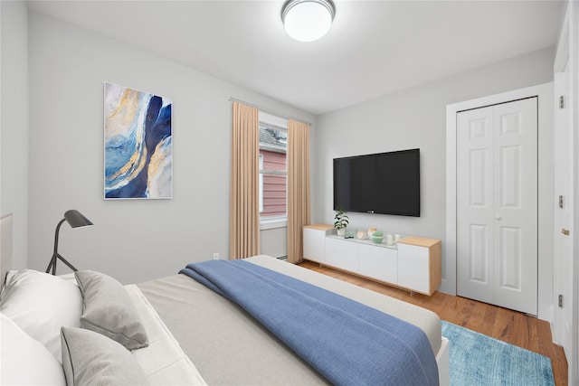 bedroom featuring wood finished floors