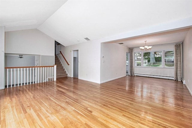 interior space featuring visible vents, stairway, a baseboard heating unit, light wood finished floors, and an inviting chandelier