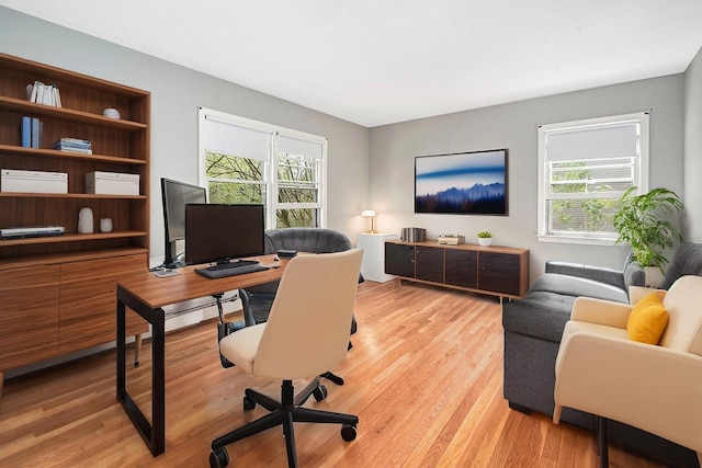 home office featuring light wood-style floors