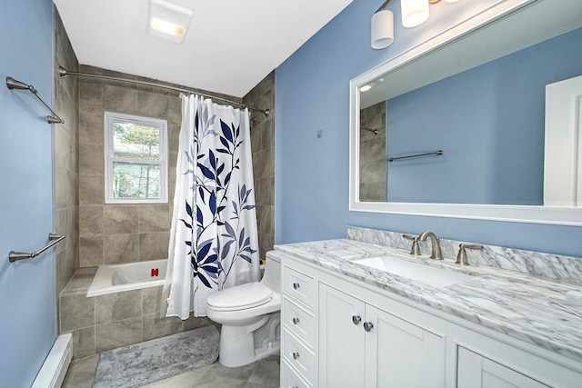 full bath featuring vanity, tile patterned flooring, tiled shower / bath combo, and toilet