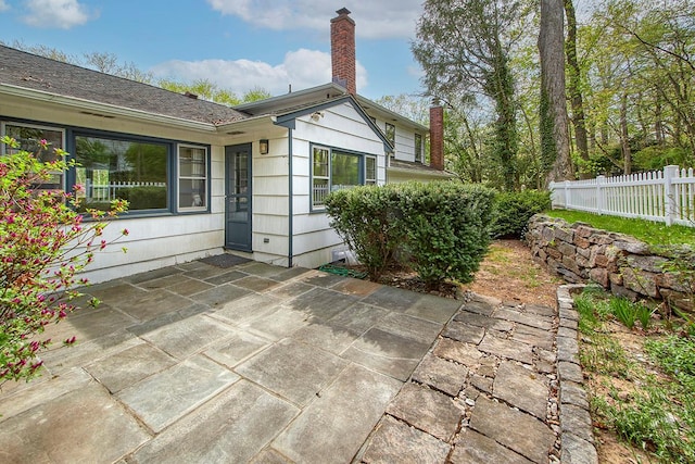 view of patio featuring fence