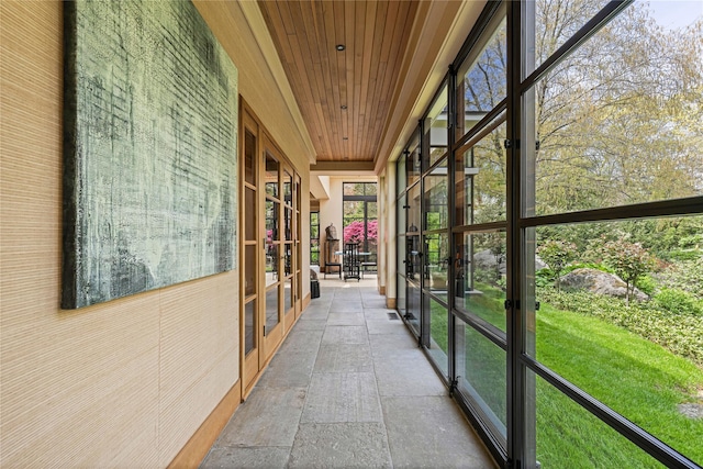 unfurnished sunroom featuring french doors