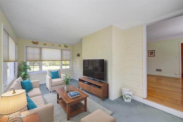 living room with visible vents and baseboards