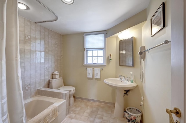 full bath featuring tile walls, a sink, shower / bath combination with curtain, toilet, and tile patterned flooring