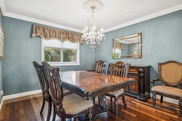 dining space featuring wood-type flooring, baseboards, an inviting chandelier, and ornamental molding