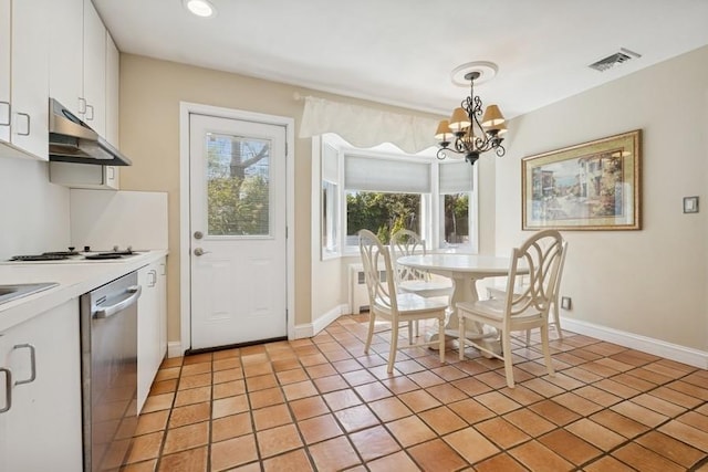 kitchen featuring stainless steel dishwasher, light countertops, white cabinets, a notable chandelier, and under cabinet range hood