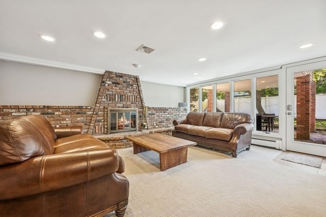 living area featuring visible vents, a fireplace, a baseboard radiator, light carpet, and recessed lighting