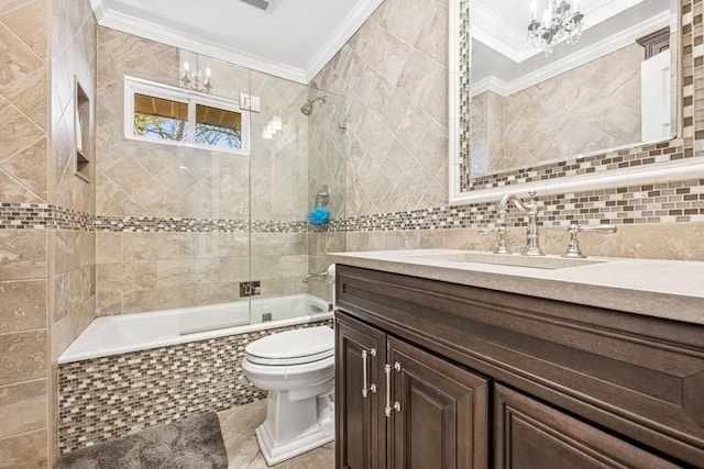 full bath featuring toilet, a chandelier, tile walls, tiled shower / bath combo, and ornamental molding