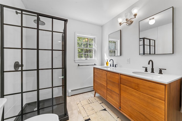 full bathroom with a sink, walk in shower, a baseboard heating unit, and double vanity