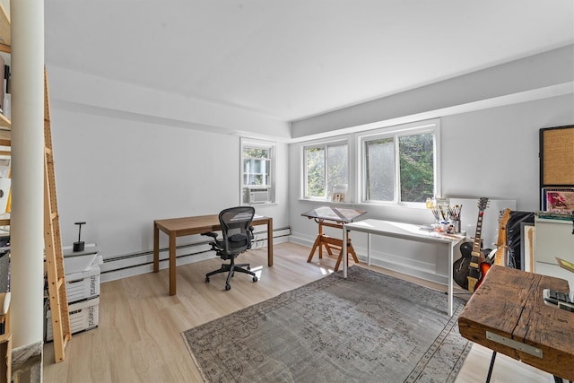 home office featuring baseboard heating and light wood finished floors