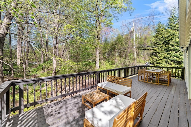wooden terrace with outdoor dining space