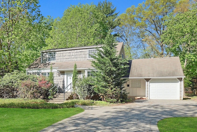 35 Harding St, Pearl River, NY 10965 - view of front of property featuring a garage and decorative driveway