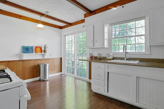 35 Harding St, Pearl River, NY 10965 - kitchen featuring a sink, gas range gas stove, a wainscoted wall, dark wood-type flooring, and beamed ceiling