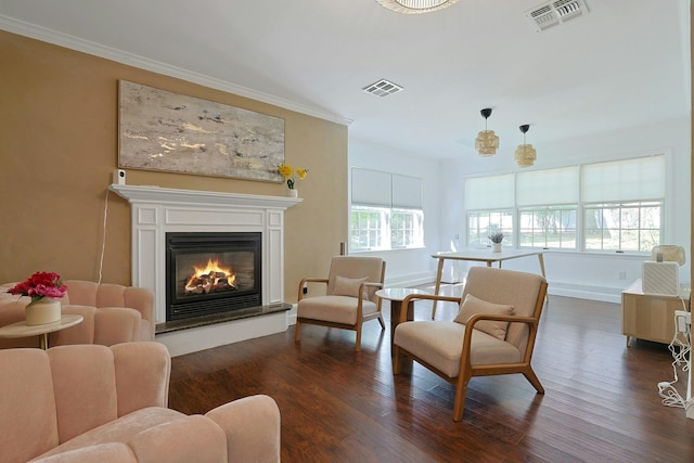 35 Harding St, Pearl River, NY 10965 - living area featuring visible vents, ornamental molding, dark wood finished floors, and a glass covered fireplace