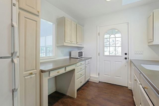 35 Harding St, Pearl River, NY 10965 - doorway with built in desk, dark wood finished floors, and a wealth of natural light