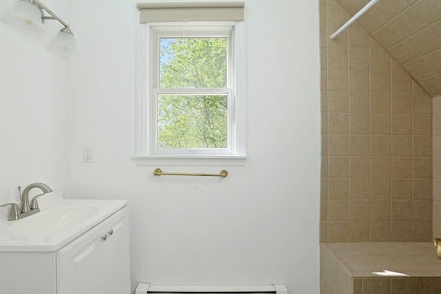 35 Harding St, Pearl River, NY 10965 - bathroom with baseboard heating, tiled shower, and vanity