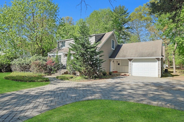 35 Harding St, Pearl River, NY 10965 - view of front of home featuring a garage and decorative driveway
