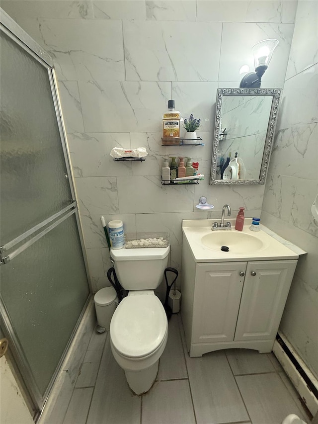 bathroom with a baseboard radiator, toilet, vanity, and a stall shower
