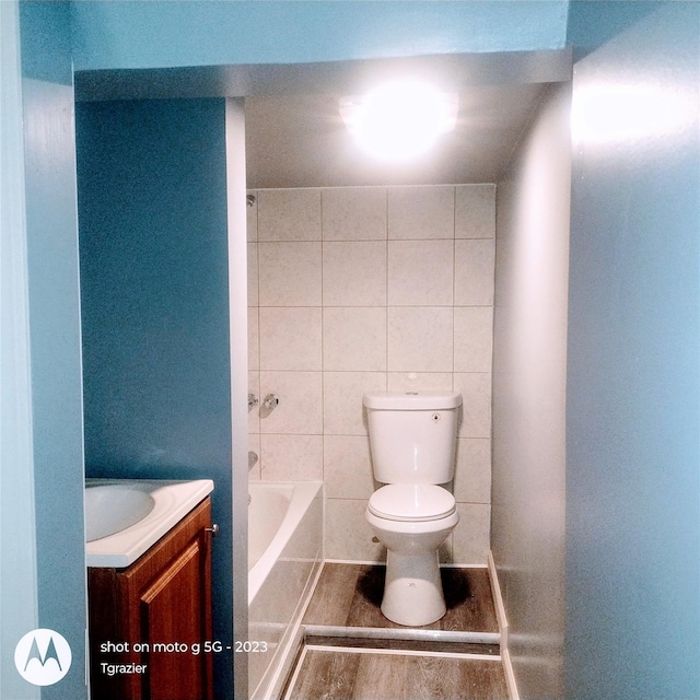 109 Lake Ave, Middletown, NY 10940 - full bathroom with toilet, vanity, wood finished floors, and  shower combination