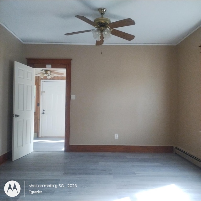 109 Lake Ave, Middletown, NY 10940 - spare room featuring ornamental molding, wood finished floors, a ceiling fan, baseboards, and baseboard heating