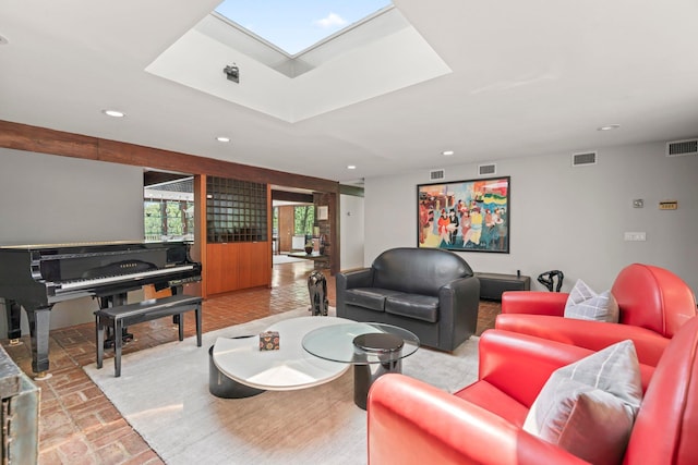 living room featuring visible vents, brick floor, and recessed lighting