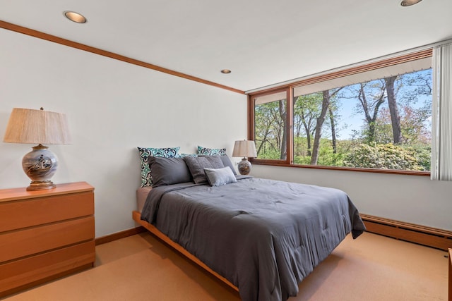 bedroom featuring a baseboard radiator, light carpet, baseboards, and recessed lighting