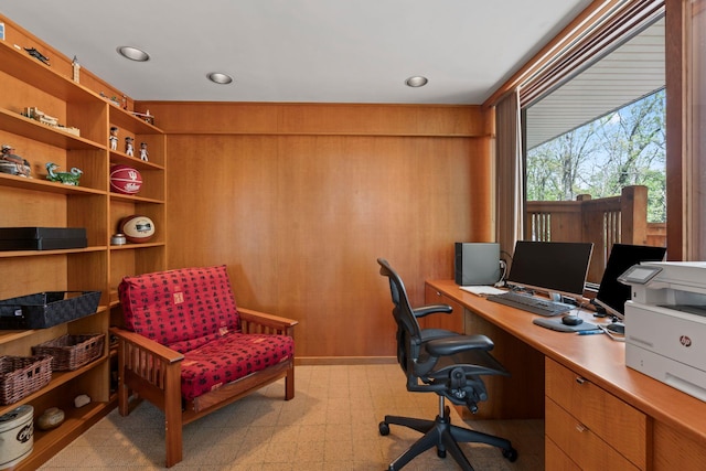 home office with light floors and recessed lighting