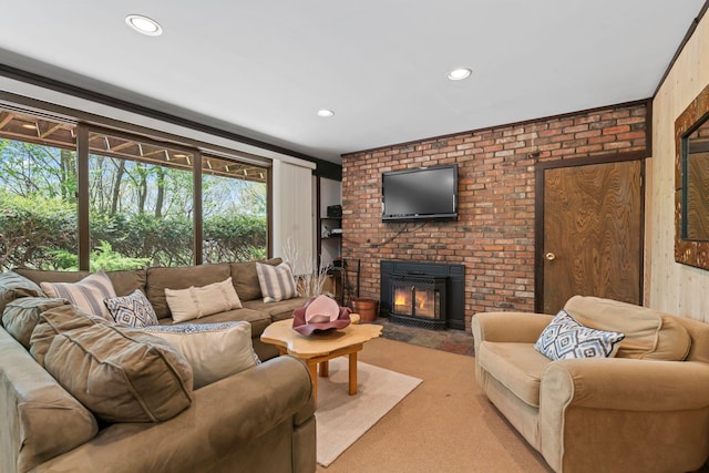 living room with light colored carpet, a brick fireplace, and recessed lighting