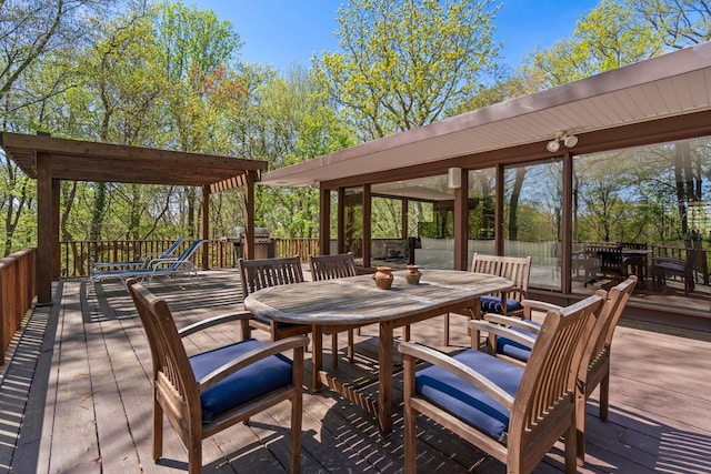 wooden terrace with outdoor dining area