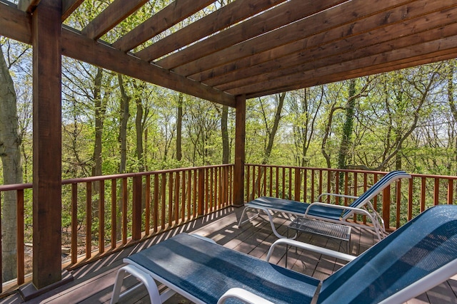 deck featuring a wooded view